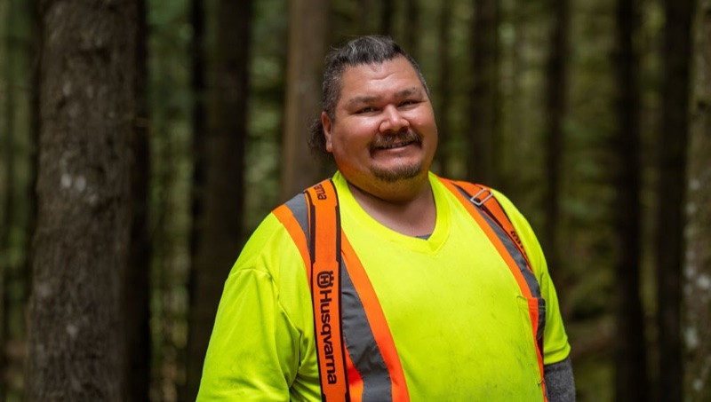 John Yelton working in the forest